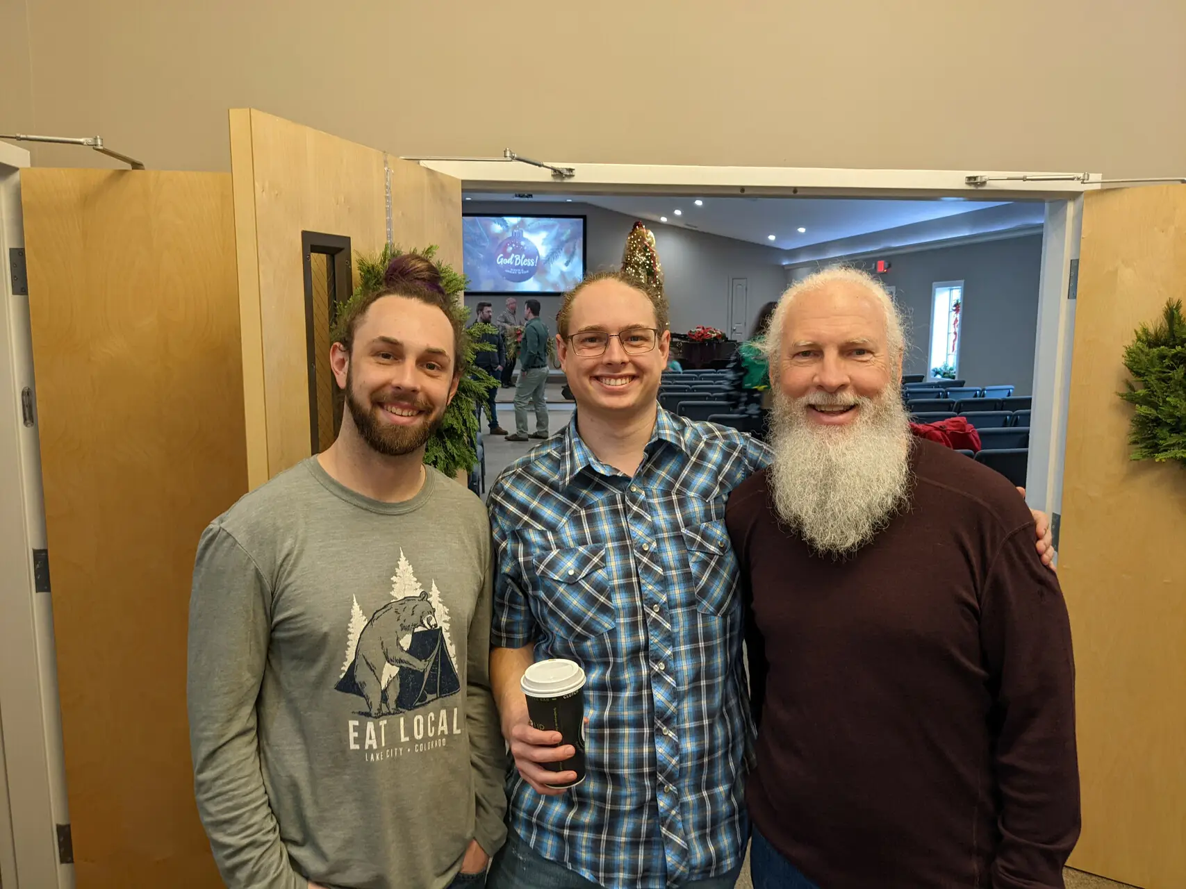 Chip, Chas, and Clayton in the church foyer